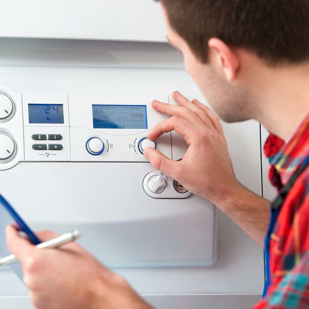 One of our team checking over a boiler