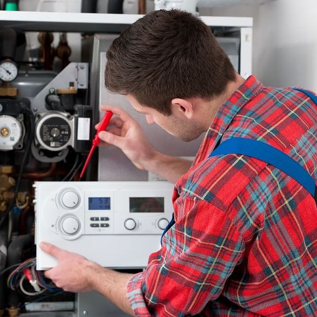 One of our team installing a boiler