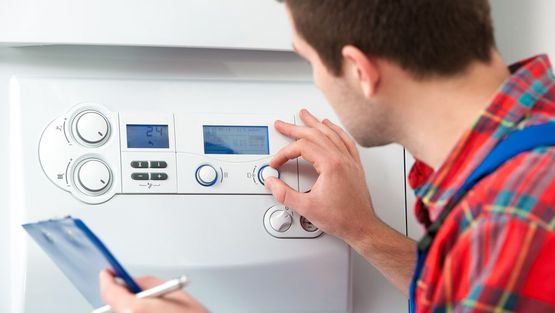 One of our team checking a boiler